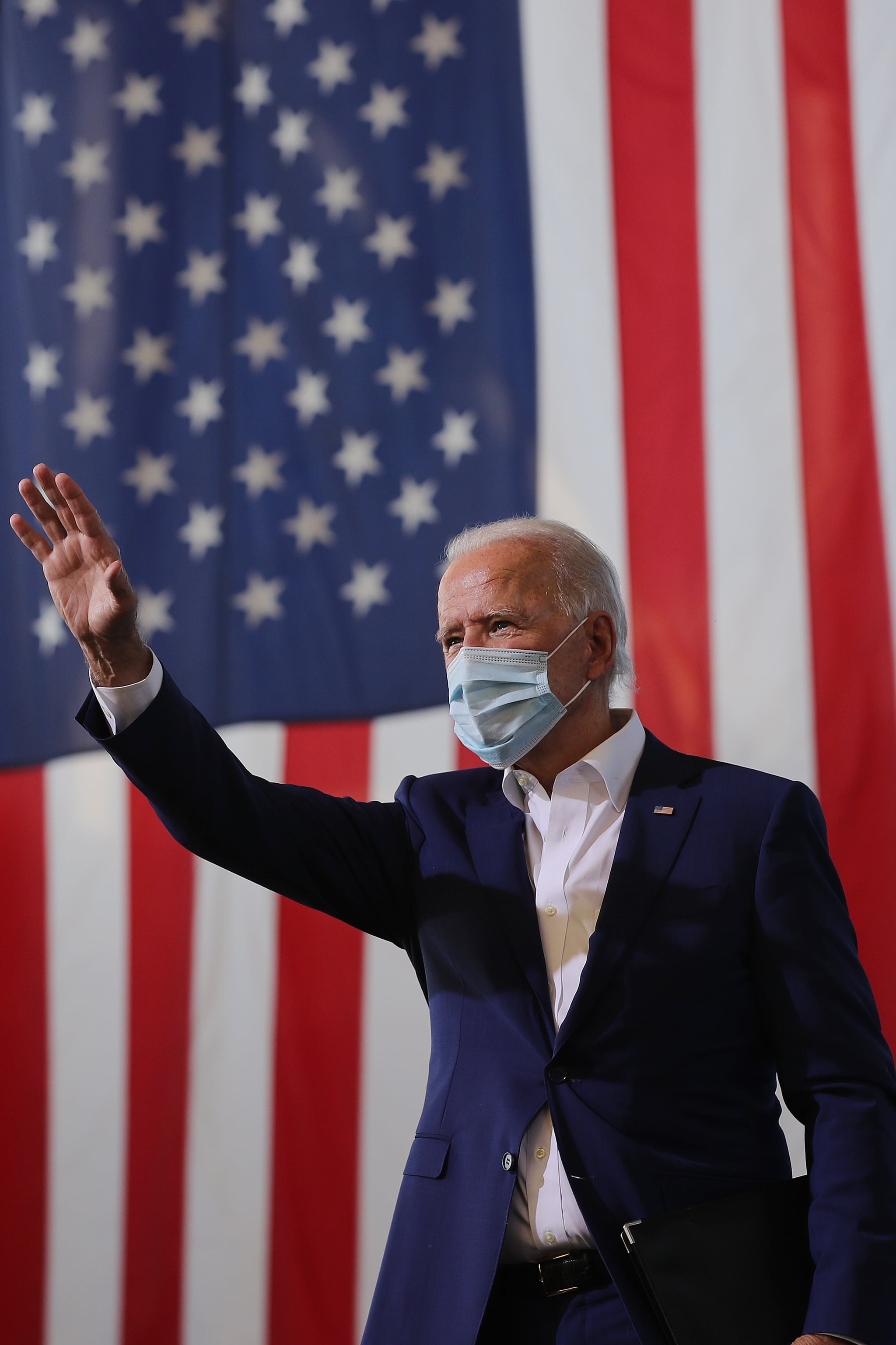 MIRAMAR, FLORIDA - OCTOBER 13: Wearing a face mask to reduce the risk posed by the coronavirus, Democratic presidential nominee Joe Biden waves to supporters during a drive-in voter mobilization event at Miramar Regional Park October 13, 2020 in Miramar, Florida. With three weeks until Election Day, Biden is campaigning in Florida. (Photo by Chip Somodevilla/Getty Images)