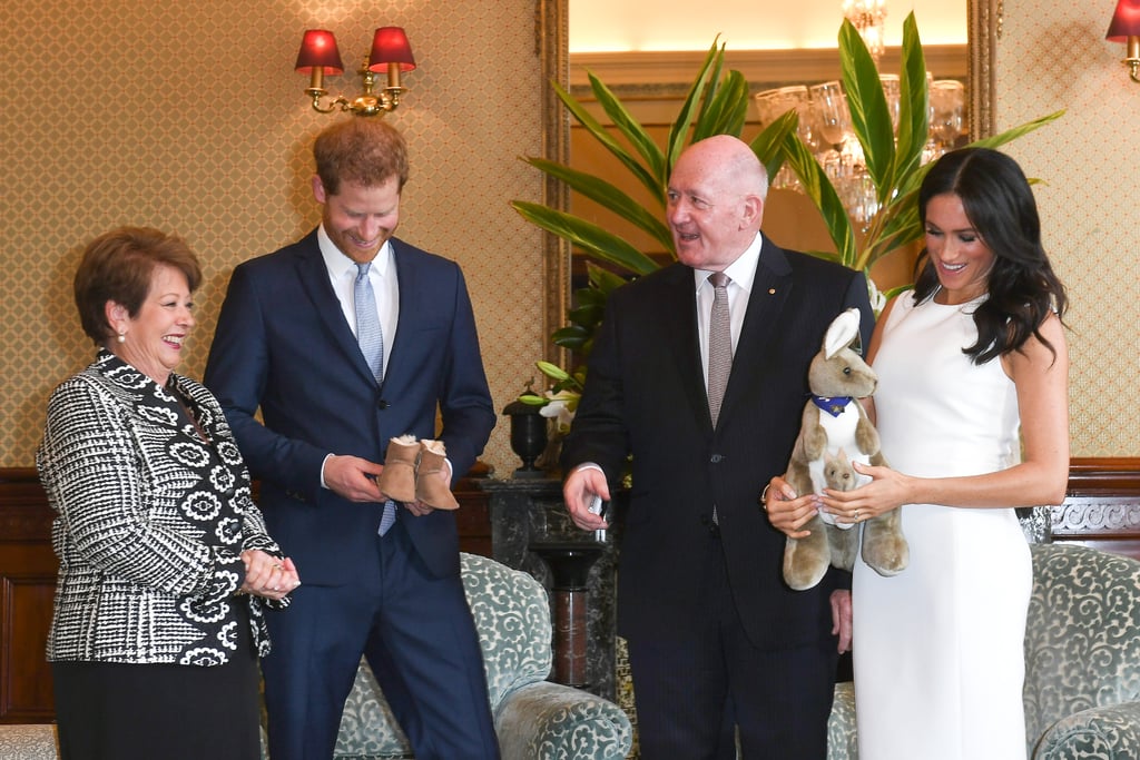 Meghan received her first baby gift wearing the "Blessed dress."
