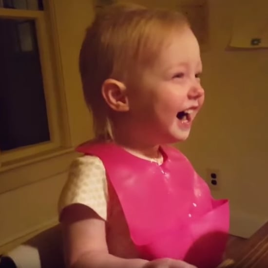 Little Girl Laughing at Snow