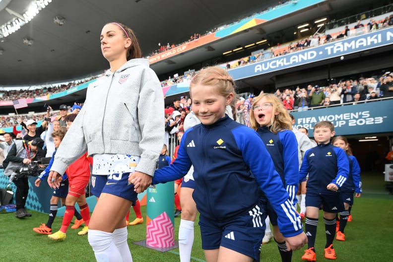 AUCKLAND, NEW ZEALAND - JULY 22: Alex Morgan of USA walks into the pitch with a mascot prior to the FIFA Women's World Cup Australia & New Zealand 2023 Group E match between USA and Vietnam at Eden Park on July 22, 2023 in Auckland / Tāmaki Makaurau, New 