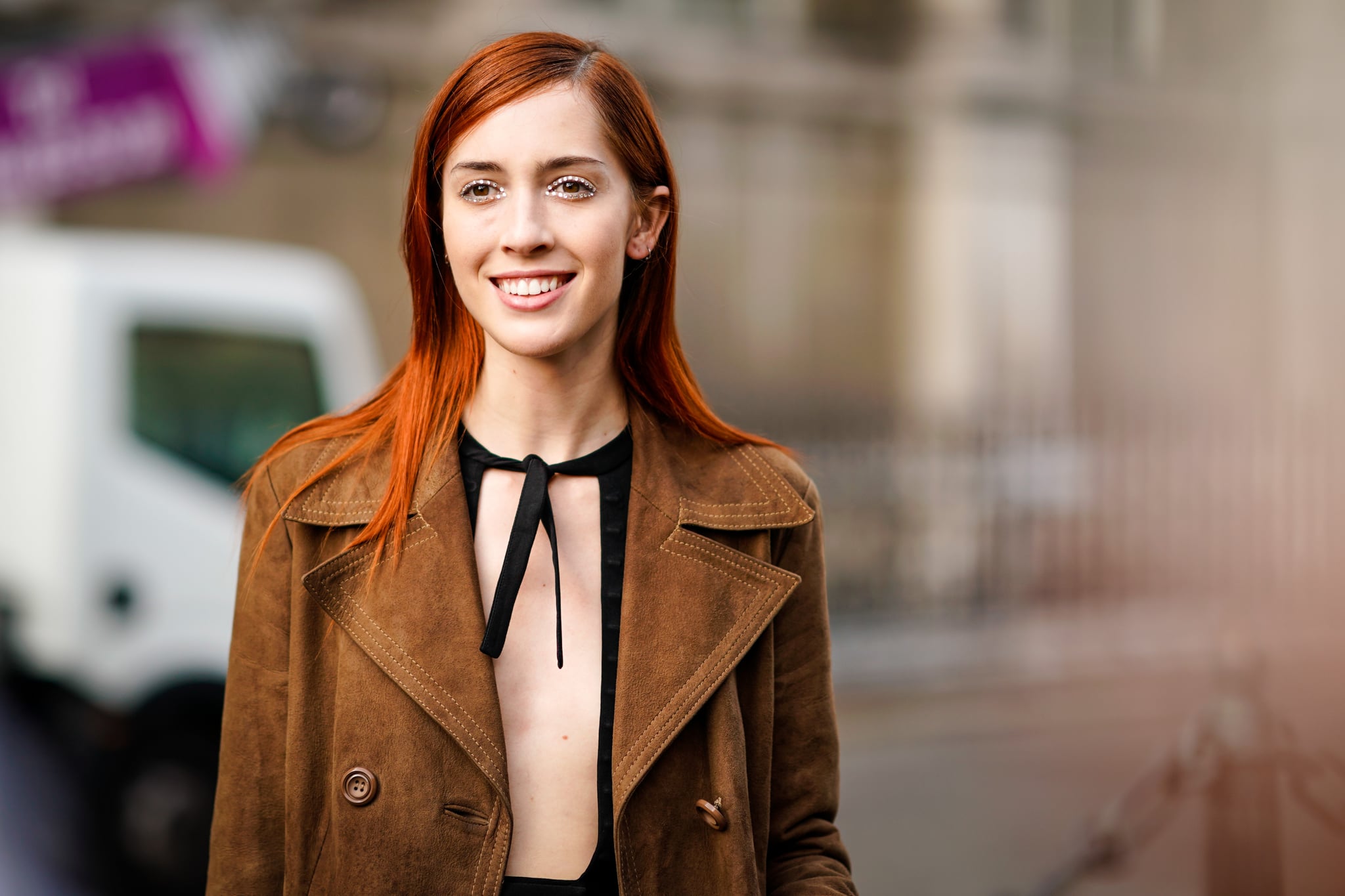 PARIS, FRANCE - SEPTEMBER 27:  Teddy Quinlivan, model, wears a brown suede trench coat, outside the Dries Van Noten show, during Paris Fashion Week Womenswear Spring/Summer 2018, on September 27, 2017 in Paris, France.  (Photo by Edward Berthelot/Getty Images)