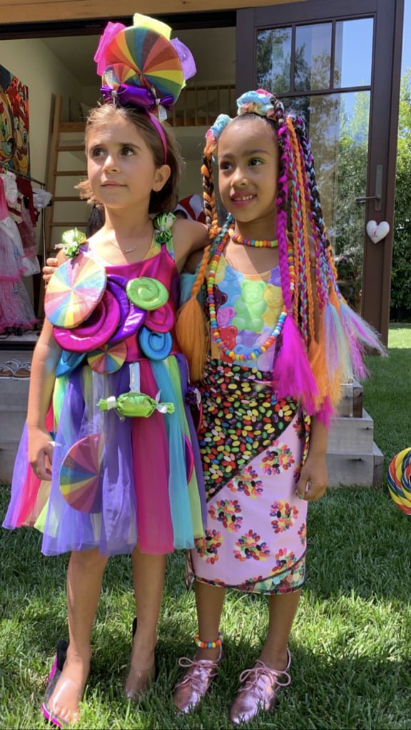 Kim and Kourtney Kardashian threw a fun-filled party for each of their little girls' birthdays on Saturday. While Kim celebrated daughter North turning 6 on June 15, Kourtney gave Penelope an early celebration before she turns 7 on July 8. The theme of the soirée was Candy Land, so of course there were tons of treats and colorful decorations at the get-together. Besties North and Penelope — who share a joint birthday bash every year — were also dressed up in brightly colored ensembles as they enjoyed the fun festivities.
Kim and Kourtney posted a series of videos on their Instagram stories to document the vibrant dreamland. They showed off a rainbow walkway, giant balloons, and jars overflowing with gummy bears and other sugary snacks. North and Penelope also got their own monster-size cake embellished with confectioneries and filled with sprinkles on the inside. To help partygoers cool down, there was even an ice cream truck. "Mister Softee is here, and mine already melted, but I'm in heaven," Kim said in one clip.  
Look ahead to see more pictures from the sweet shindig!

    Related:

            
            
                                    
                            

            Keeping Up With the Kardashian-Jenner Kids: Who Belongs to Whom?