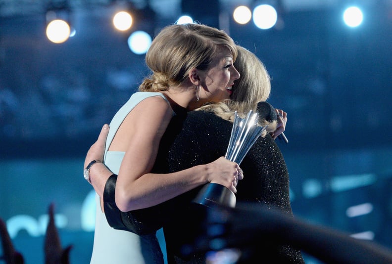 ARLINGTON, TX - APRIL 19:  Honoree Taylor Swift (L) accepts the Milestone Award from Andrea Finlay onstage during the 50th Academy of Country Music Awards at AT&T Stadium on April 19, 2015 in Arlington, Texas.  (Photo by Mike Windle/ACM2015/Getty Images f