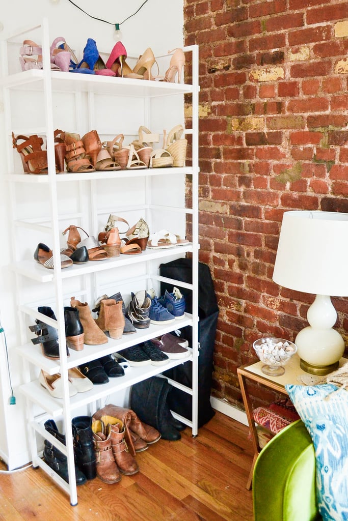 Bookshelves are also a major space saver in any room, particularly the living room. They don't take up a lot of floor space, but they can hold a ton. And if you style them right, they can look sleek and polished. Adding a slim bookshelf to a small corner of your apartment is a great way to store your shoes as well!