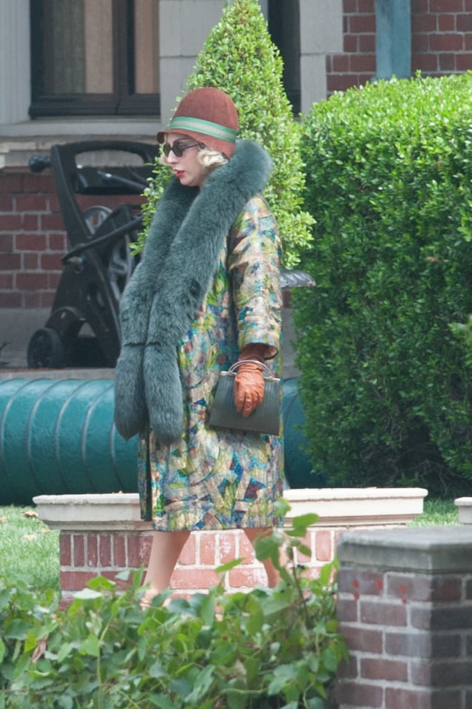 This 20's-inspired outfit included a brocade coat, furry green stole, and color-coordinated gloves, hat, and clutch.