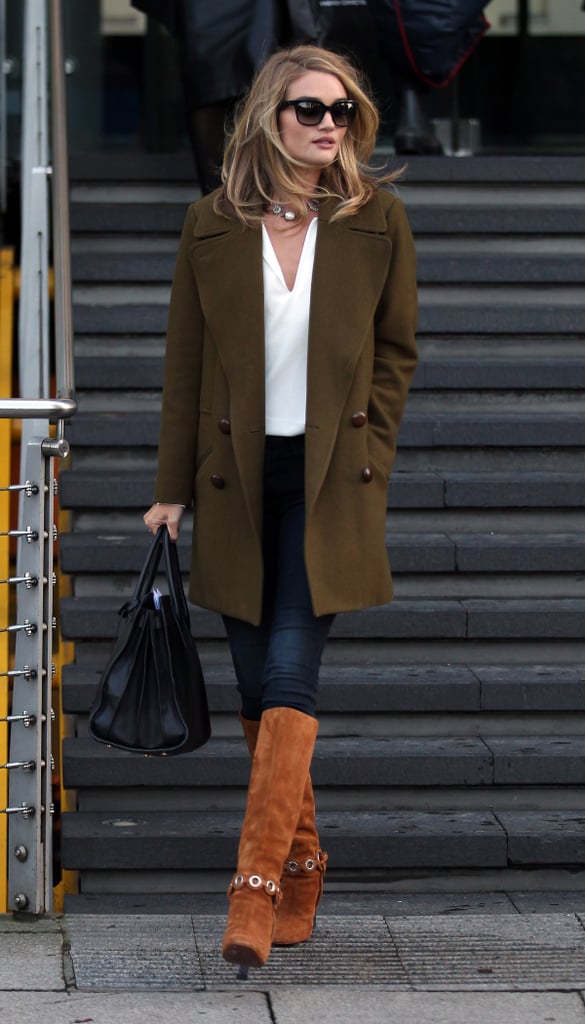 Rosie-Huntington Whiteley's olive coat and suede boots make the outfit.