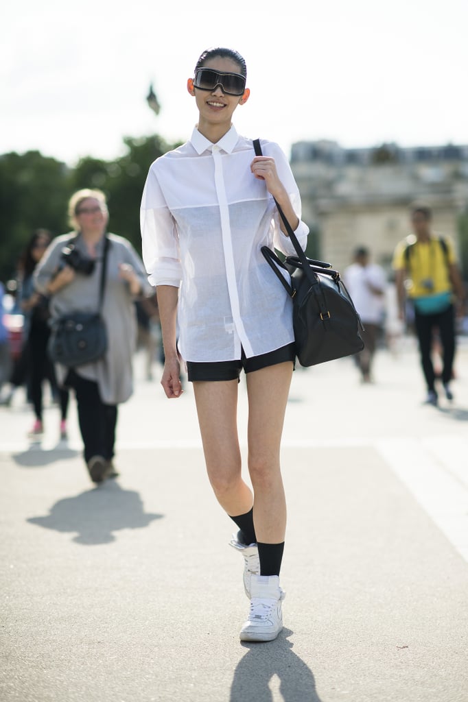 A white button-down shirt and shorts got an upgrade with visor shades and old-school kicks.
Source: Le 21ème | Adam Katz Sinding