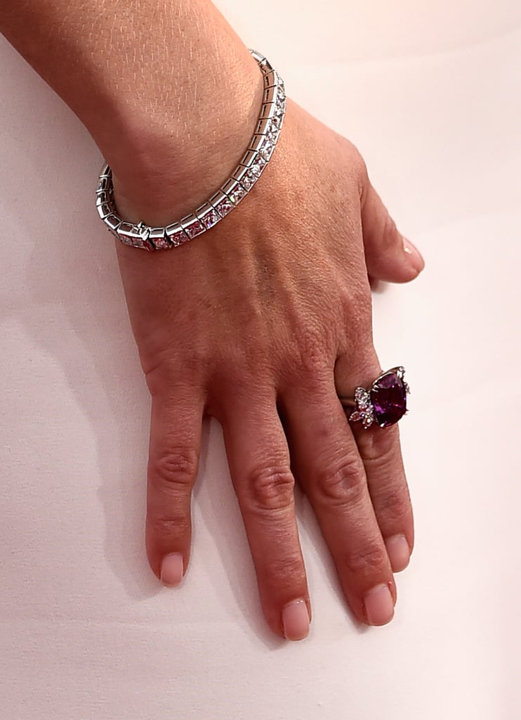 Reese Witherspoon chose Harry Winston and Tiffany & Co. to accessorize her sleek all-white Giorgio Armani gown.