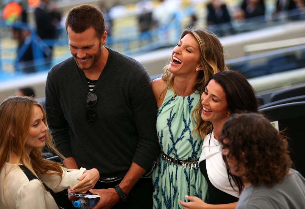 Tom Brady and Gisele Bündchen laughed with friends at the game.