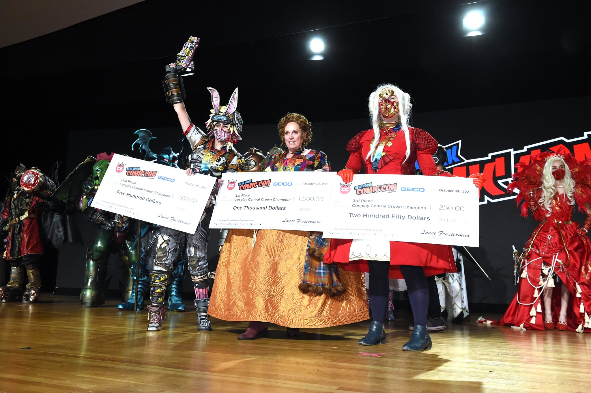 NEW YORK, NEW YORK - OCTOBER 09: Cosplayers pose with their prizes during the Cosplay Central Crown Championships at NYCC during Day 3 of New York Comic Con 2021 at Jacob Javits Center on October 09, 2021 in New York City. (Photo by Bryan Bedder/Getty Images for ReedPop)