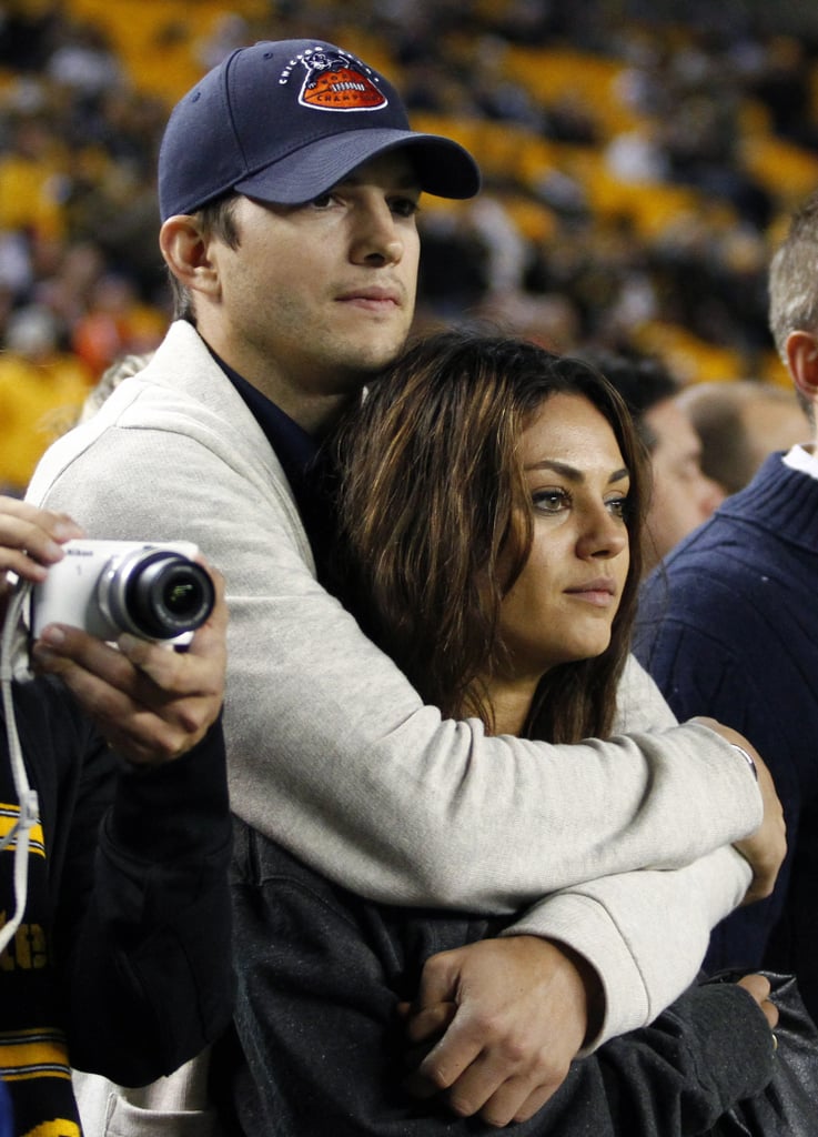 Ashton Kutcher and Mila Kunis cuddled up as the Chicago Bears played the Steelers in Pittsburgh on Sunday.