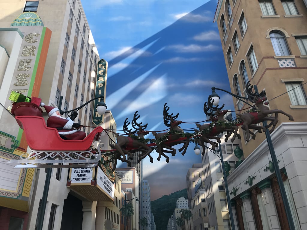 Santa Claus and his sleigh sail over Hollywood in Disney California Adventure.