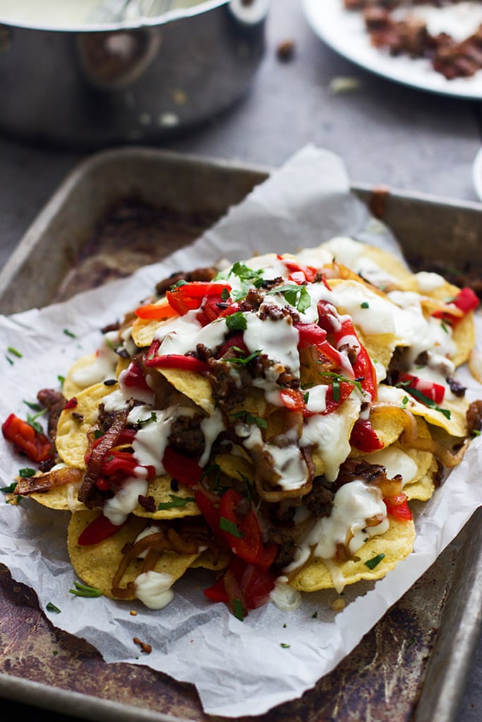 Italian-Style Nachos With Provolone Cheese Sauce, Turkey Sausage, and Roasted Red Peppers