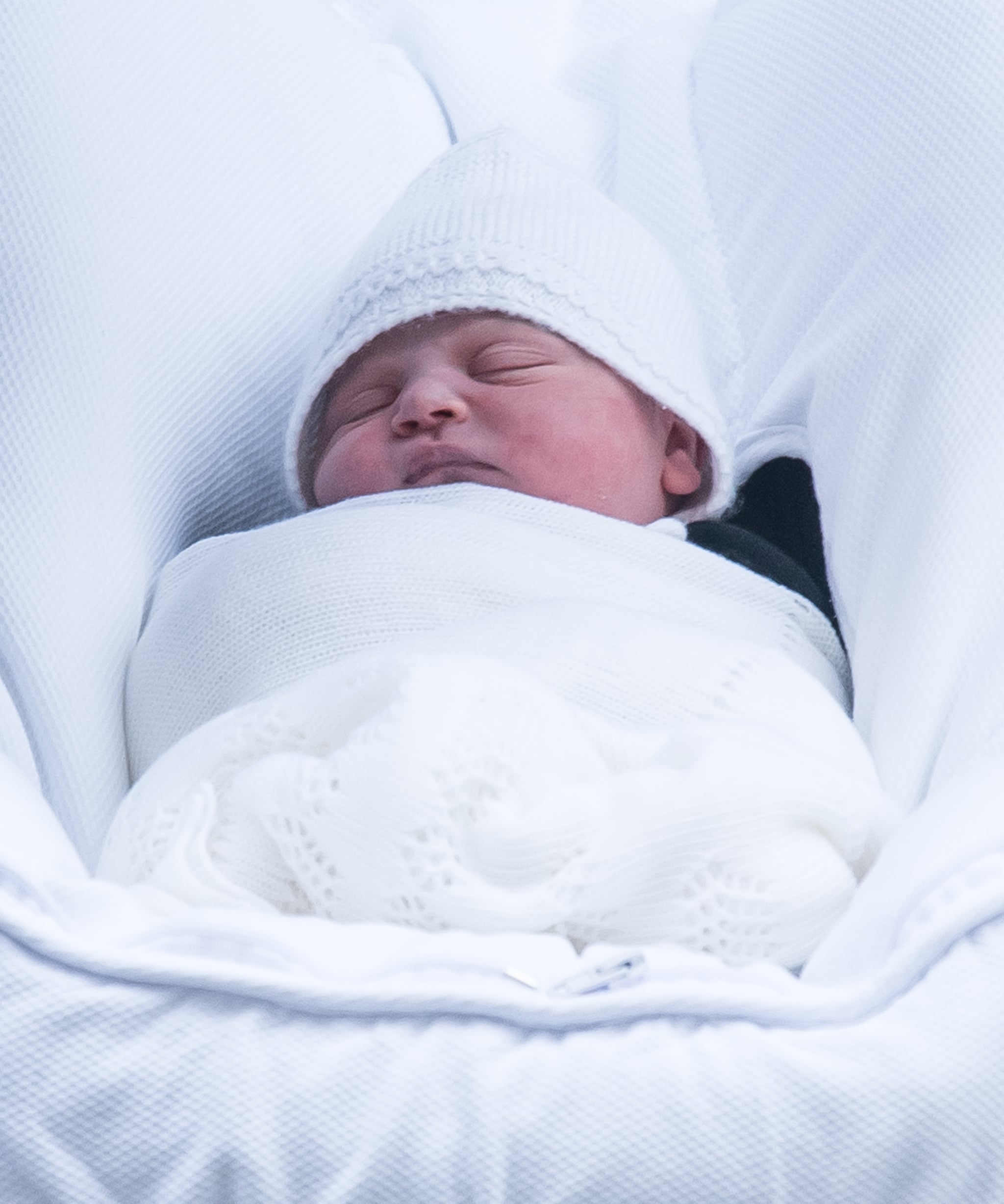 LONDON, ENGLAND - APRIL 23: The newborn royal baby is seen as Catherine, Duchess of Cambridge and Prince William, Duke of Cambridge depart the Lindo Wing with their newborn son Prince Louis of Cambridge at St Mary's Hospital on April 23, 2018 in London, England. The Duchess safely delivered a son at 11:01 am, weighing 8lbs 7oz, who will be fifth in line to the throne.  (Photo by Samir Hussein/WireImage)