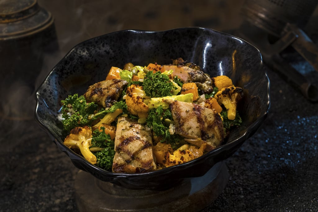 Oven-roasted Tip Yip, or roasted chicken with mixed greens, roasted vegetables, quinoa, and pumpkin seeds coated in a creamy green curry ranch dressing, can be found at Docking Bay 7 Food and Cargo.