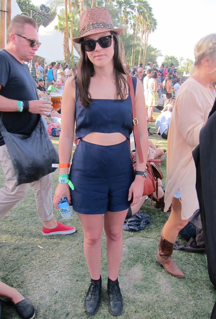 This Coachella attendee showed off Spring's crop-top trend in a sweet, high-waisted navy pairing accessorized with a straw fedora and black lace-up ankle boots.
Source: Chi Diem Chau