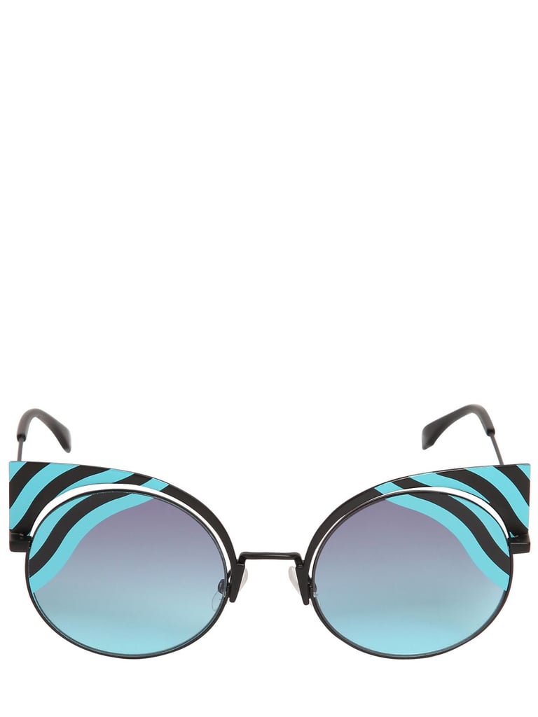 The ability to transform from a cat-eye to a round silhouette makes these bold
<product href="https://www.luisaviaroma.com/fendi/women/sunglasses/64I-IIR001/lang_EN/colorid_MjMzODY1MExCNTNKRg2?AID=10617612&PID=2178999&SID=2465974412&utm_source=CommissionJunction&utm_medium=affiliation&utm_content=2178999">Fendi Removable Cat Eye Printed Sunglasses</product> ($630) totally worth the investment.