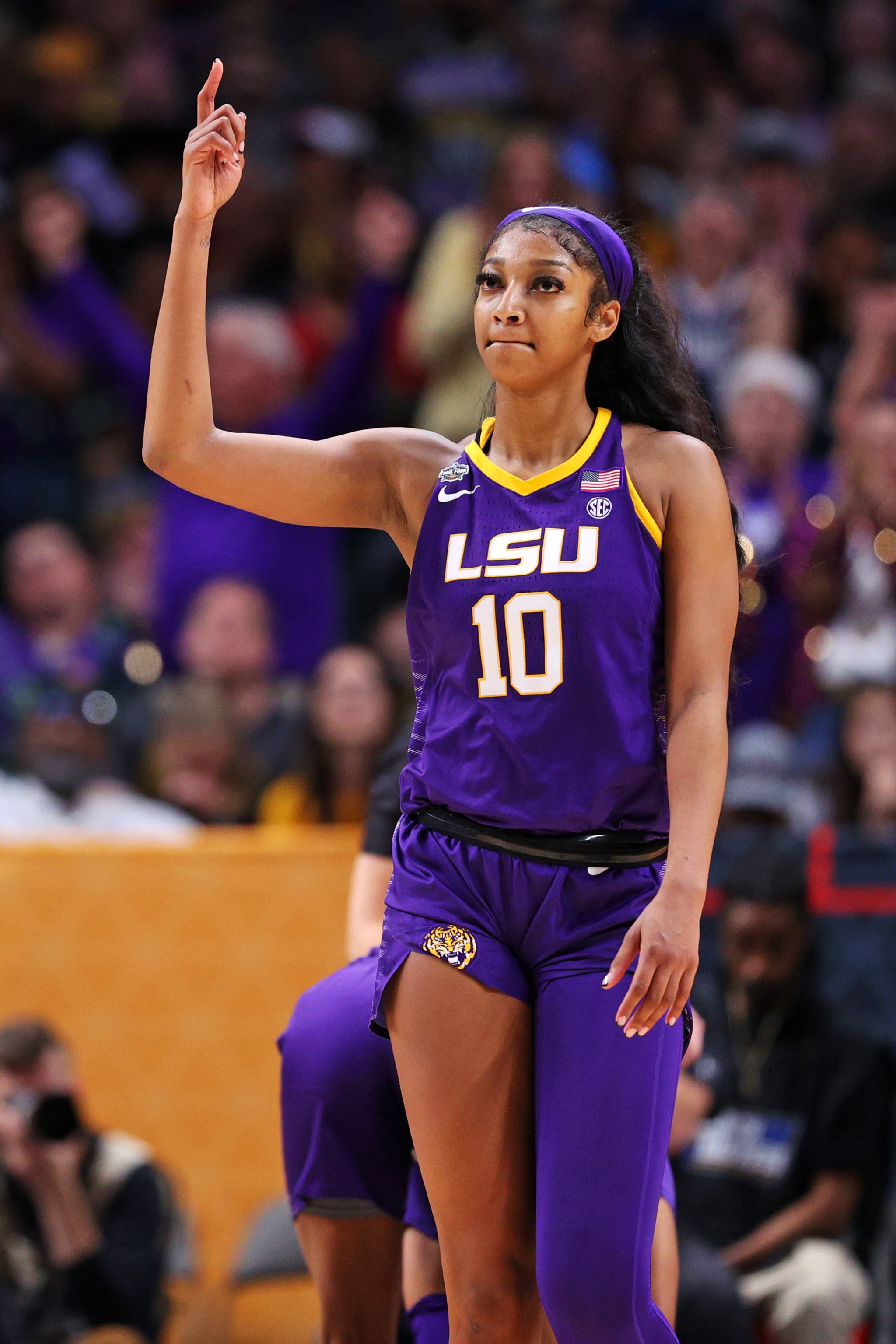 DALLAS, TEXAS - MARCH 31: Angel Reese #10 of the LSU Lady Tigers reacts after the 79-72 victory over the Virginia Tech Hokies during the 2023 NCAA Women's Basketball Tournament Final Four semifinal game at American Airlines Centre on March 31, 2023 in Dallas, Texas. (Photo by Maddie Meyer/Getty Images)