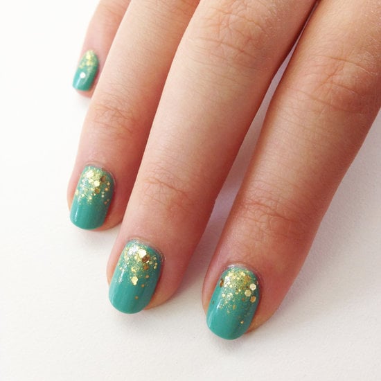 A gold glitter gradient is the perfect accent to a teal polish hue.