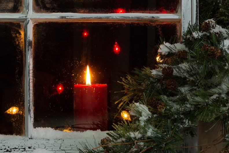 Burning a Candle in the Window During Christmastime