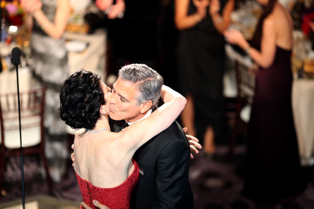 George Clooney accepted his Cecile B. DeMille award from his former ER costar Julianna Margulies.