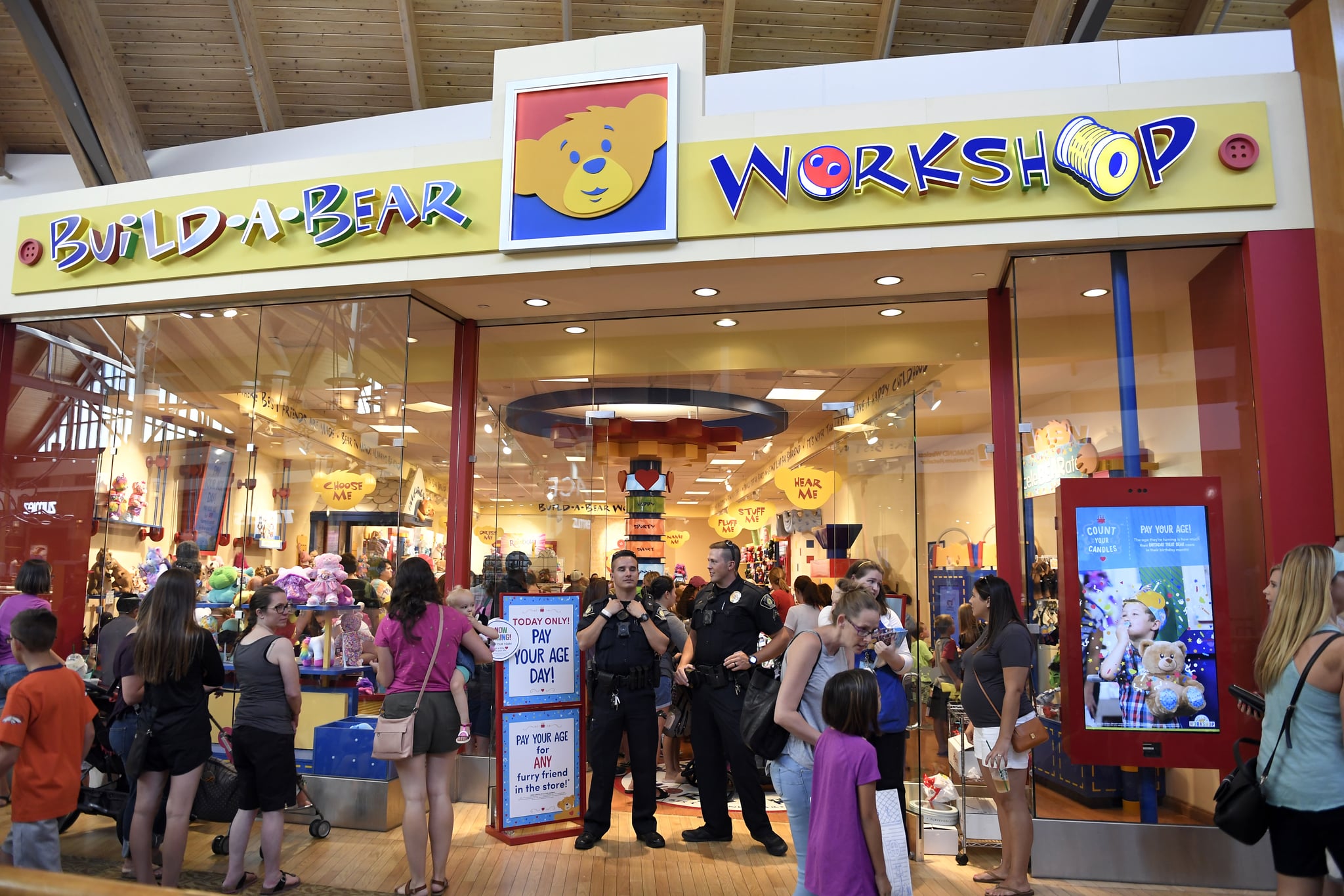 LONE TREE, CO - JULY 12: Lone Tree Police help at the front door of the Build-A-Bear store as lines stretched almost all the way around the second floor of Park Meadows Mall. Malls in metro Denver, Loveland and across the country shut down a promotion where plush bears could be purchased at a price matching a customers age July 12, 2018 in Lone Tree, Colourado. (Photo by Joe Amon/The Denver Post via Getty Images)