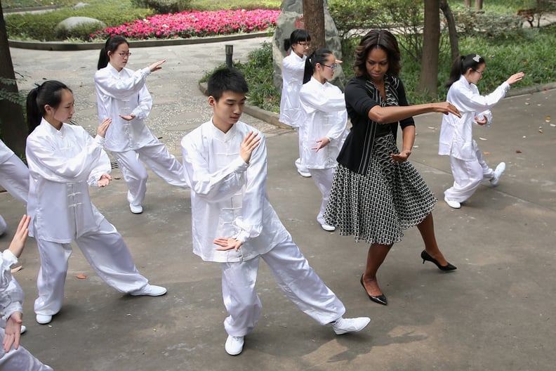Learning how to Tai Chi with Chinese students during an official visit to the country in 2014.