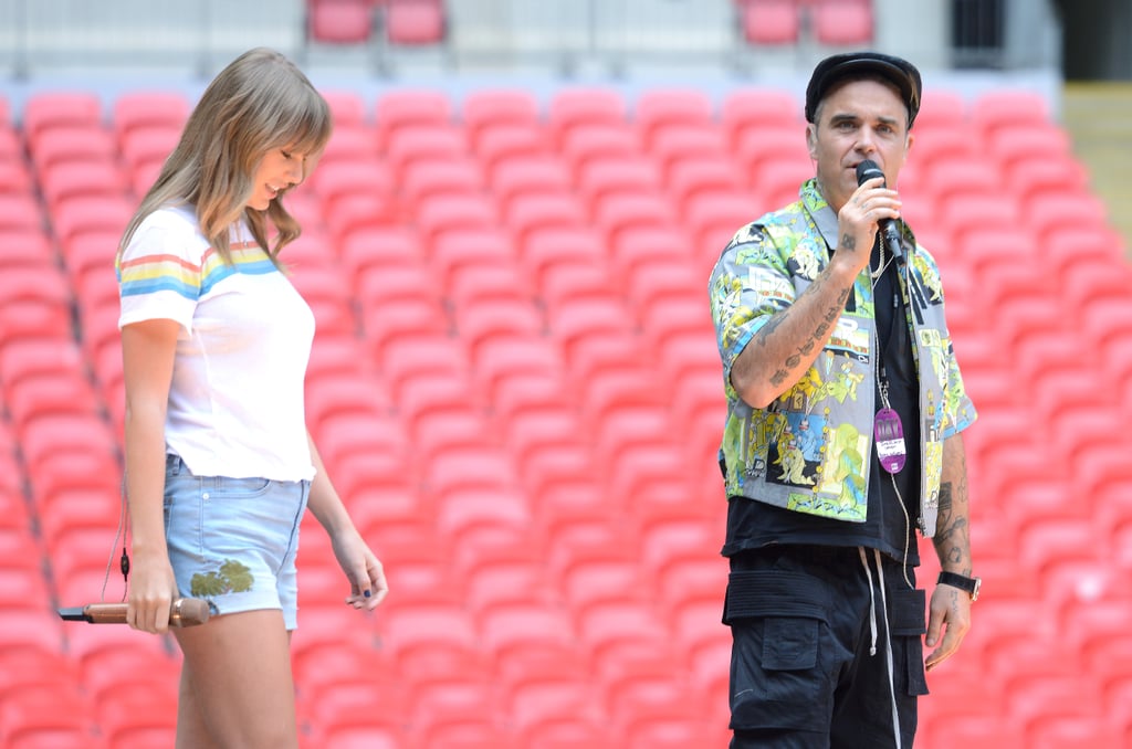 Taylor rehearsing with Robbie Williams in the Madewell High-Waist Embroidered Denim Shorts and the Elizabeth and James Lakota T-Shirt ($115).