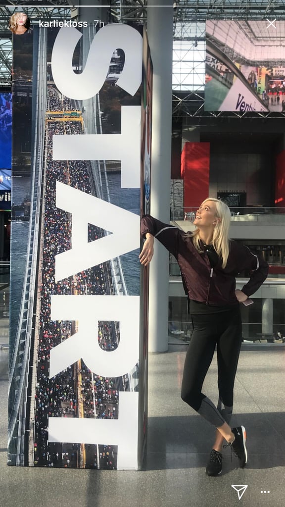 She was all smiles at the NYC Marathon expo, where she went to pick up her race bib. We'll be cheering for Karlie and all of the runners participating in this year's race!