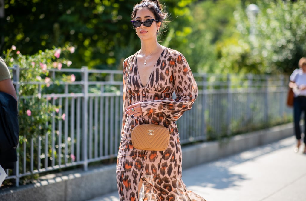 Styling a button-down dress with a quilted bag and retro sunglasses.