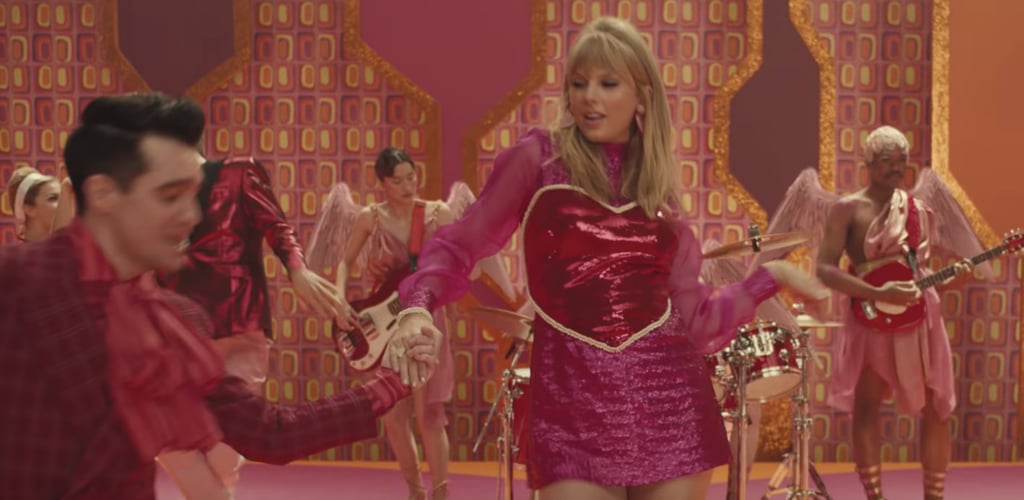 Flash back to the '60s with Swift's next look with bangs and bright eye shadow.
