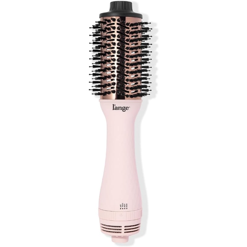 L'ange Hair Le Volume 2-in-1 Titanium Blow Dryer Brush ($48, originally $69)
If you're determined to give your hair the kind of volume you'd get from a professional blowout, this blow-dryer brush is a must-add to your shopping cart. For starters, it's pretty and pink, but more importantly, it leaves your hair shiny and frizz-free, uses ionic technology to reduce heat damage, and styles your hair fast.