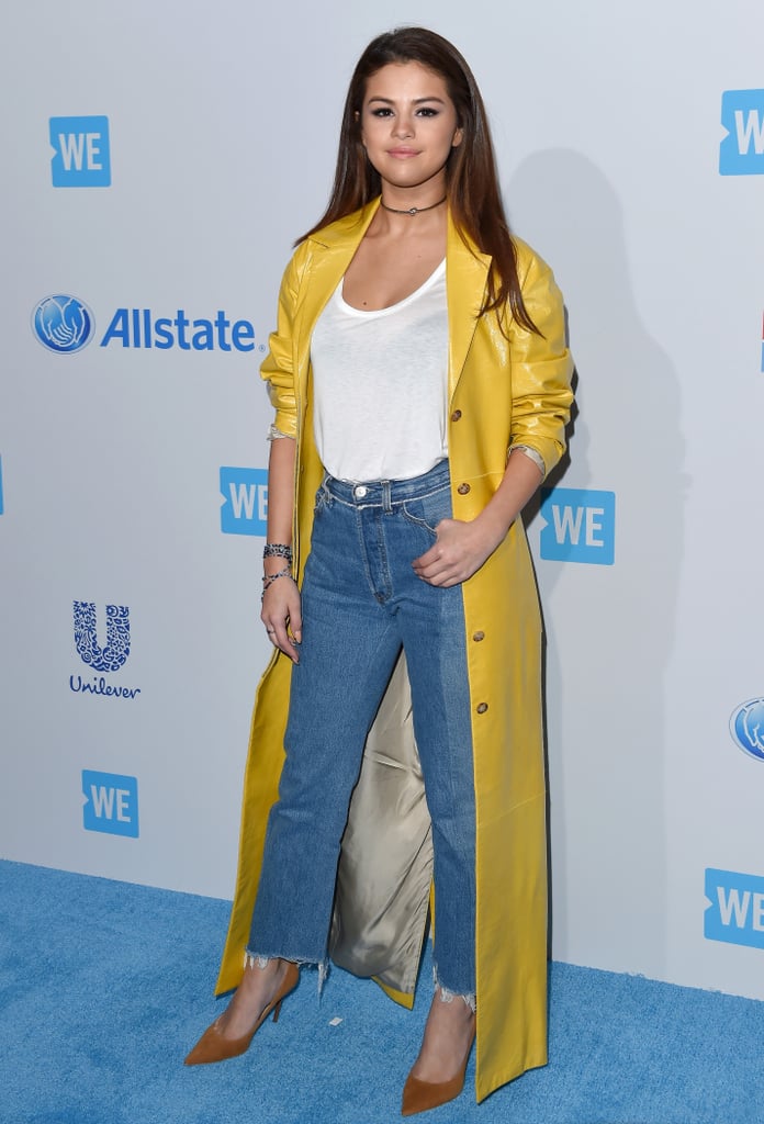 Her bright yellow floor-length duster jacket made a simple outfit of jeans and a white tee a little extra special.