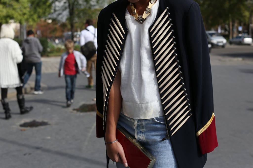 The military detailing made this coat a serious outfit asset, while her gold color and red clutch played right into the palette.
The military detailing made this coat a serious outfit asset, while her gold color and red clutch played right into the palette.