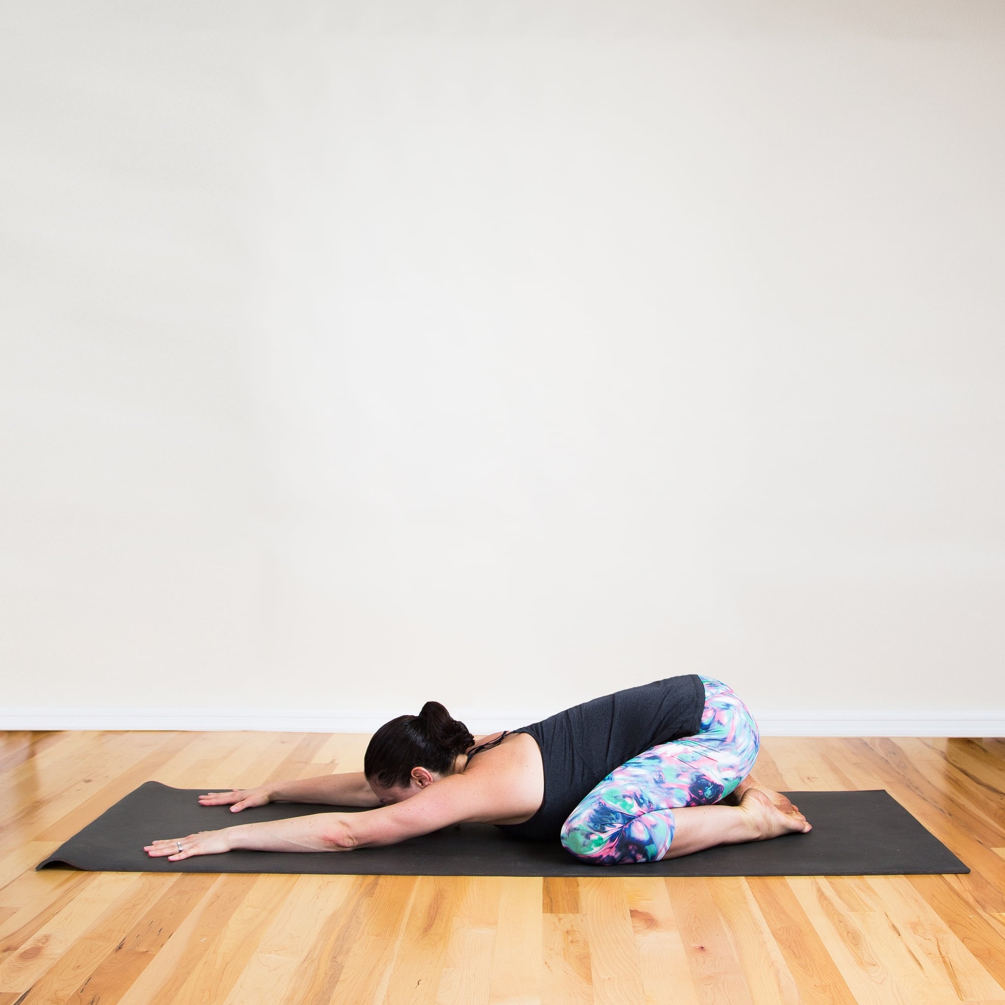 Young man doing child pose or balasana in yoga studio Stock Photo - Alamy