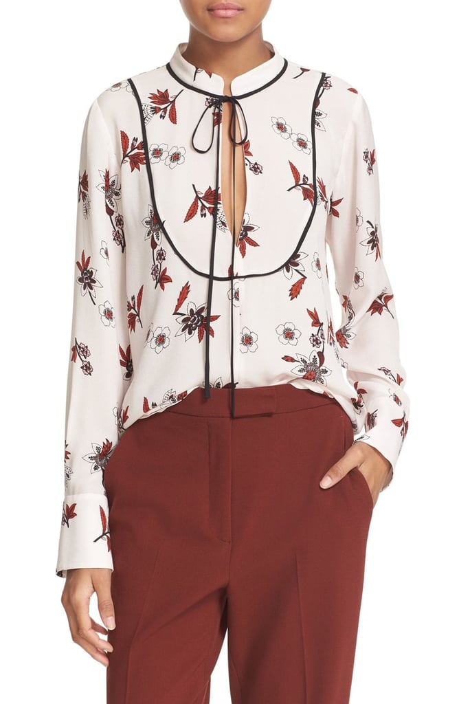 "Getting a bit more sophisticated this Fall is as easy as adding a tie-neck blouse, like this pretty printed A.L.C. version ($375) to your closet. Done and done." — HWM