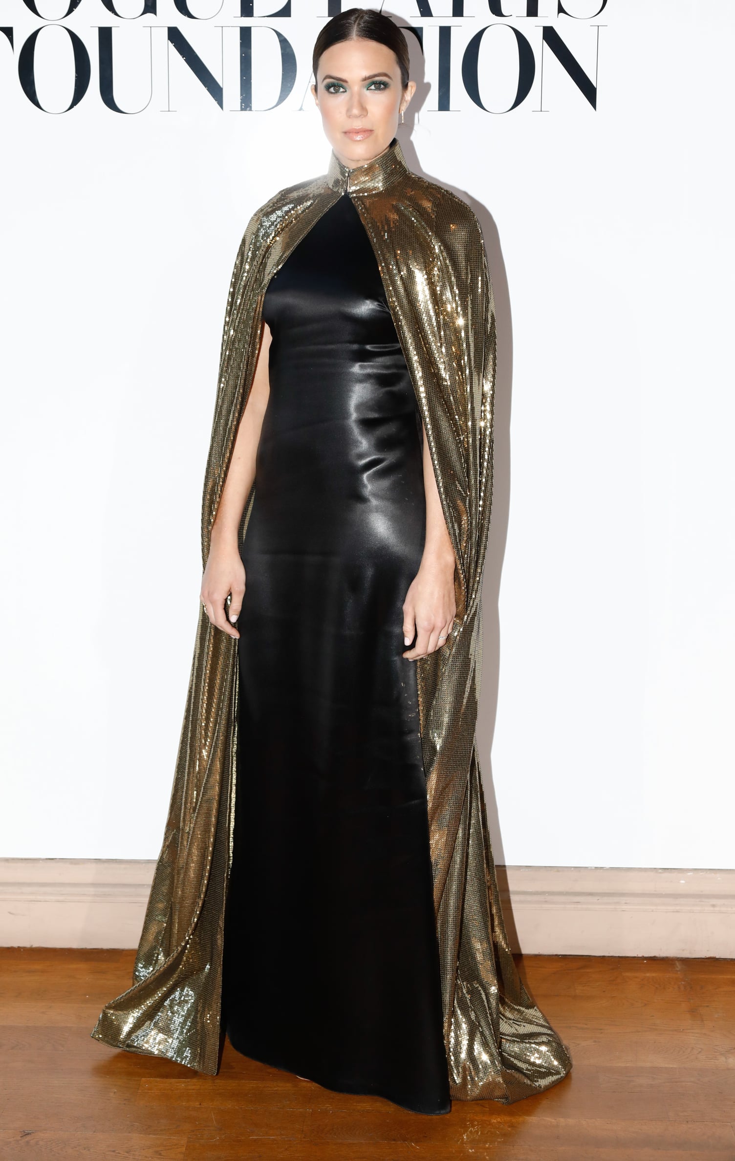 Mandy Moore in Gold Cape in Paris | POPSUGAR Fashion