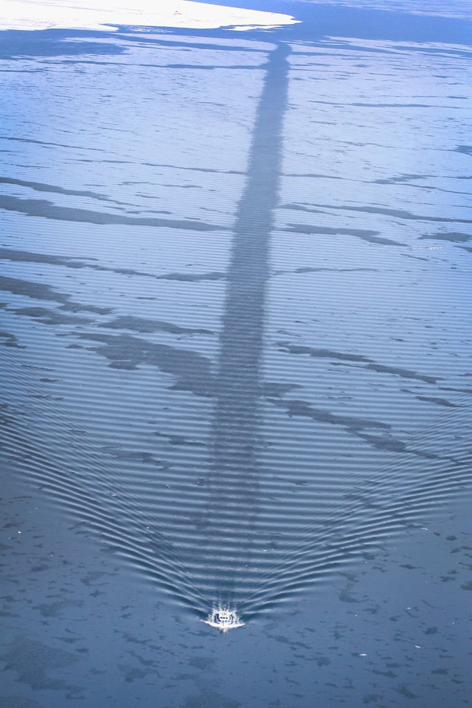 A boat traveled through the icy waters.