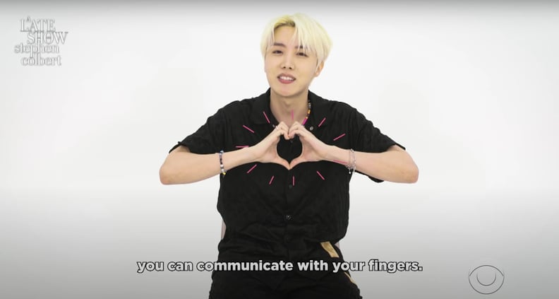 J-Hope From BTS Doing a "Heart" Hand Gesture