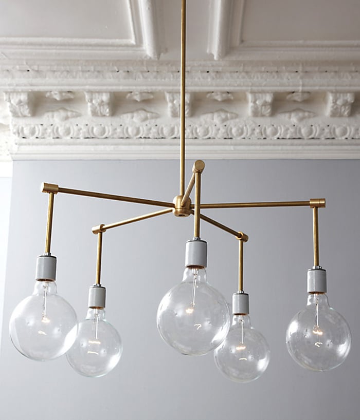 Bonus Solution: Follow the Light
Knowing how much I adored the light that was so key to my original vision, Megan designed and built her very own version and suggested we hang it in the dining room. I love how it carries the brass-and-glass look into the adjoining room.