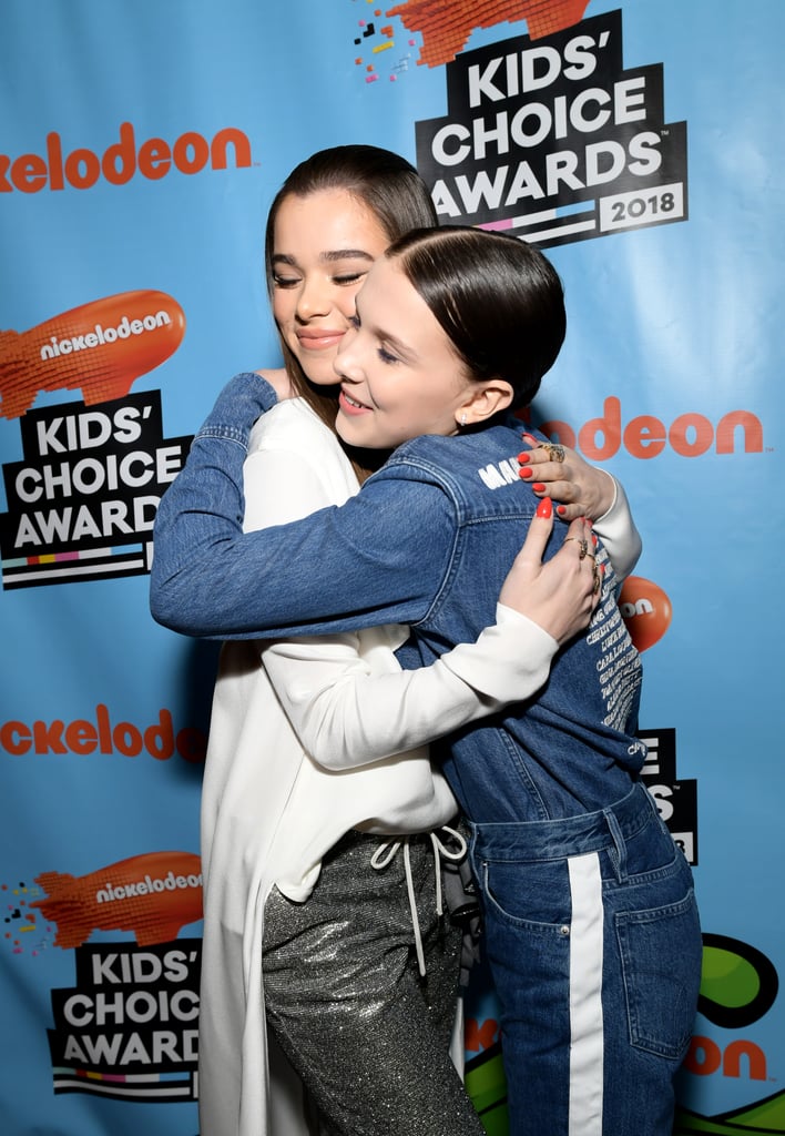 Hugging Hailee Steinfeld at the 2018 Kids' Choice Awards