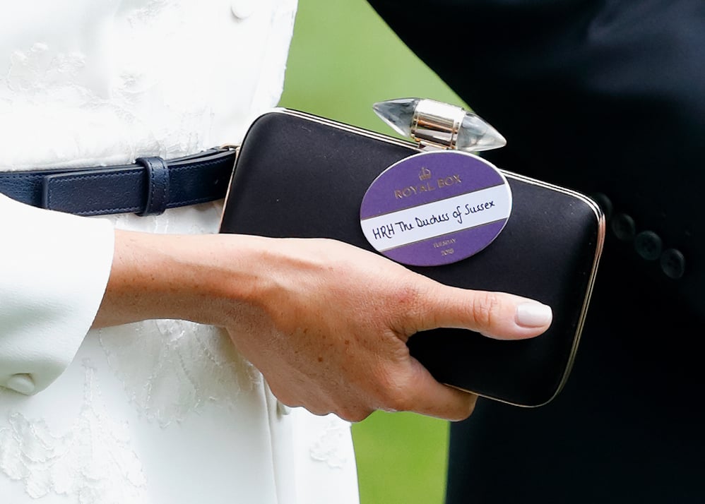 However, a closer look revealed she'd pinned her "HRH The Duchess of Sussex" badge to her clutch bag, instead.