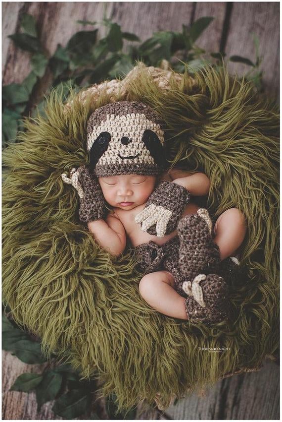 baby in a sloth costume