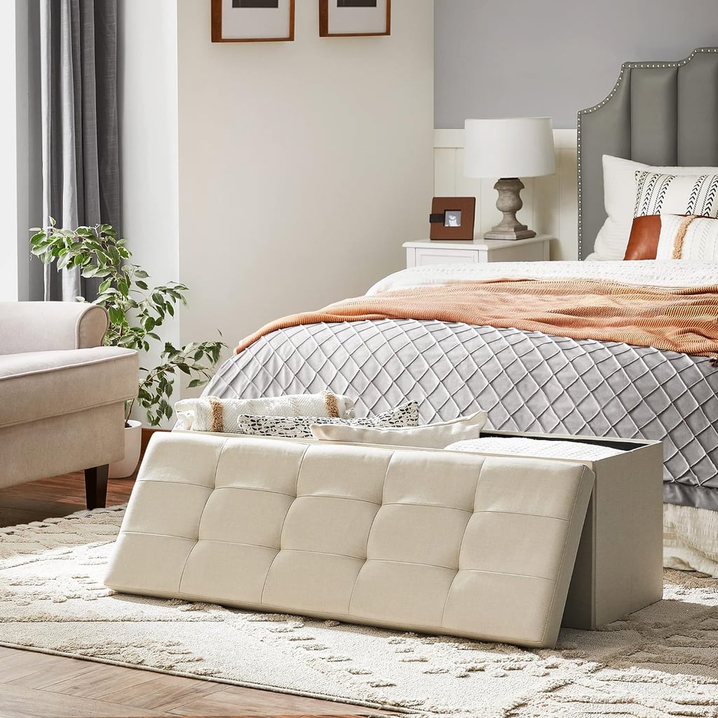 Songmics Folding Storage Ottoman Bench ($42, originally $50)
If you want to add a bench to your living room or bedroom, getting something like this storage ottoman for a super-practical blanket storage solution. It's available in a variety of colors, so you can find an option that matches your existing decor. This can serve as extra seating and a footrest, too.