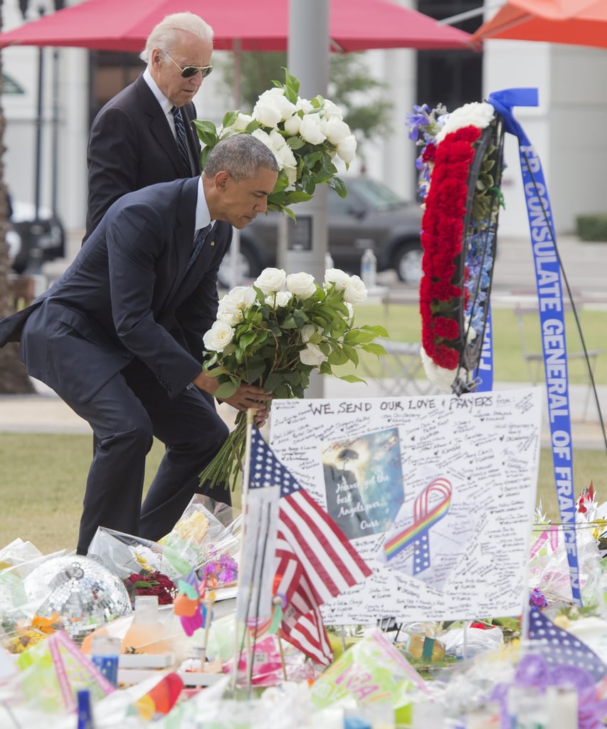 The two lay flowers at the memorial at the Dr. Phillips Center For the Performing Arts in Orlando.