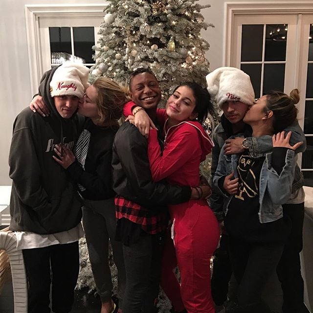 Kylie Jenner posed for a group photo with her friends in front of her festive tree.