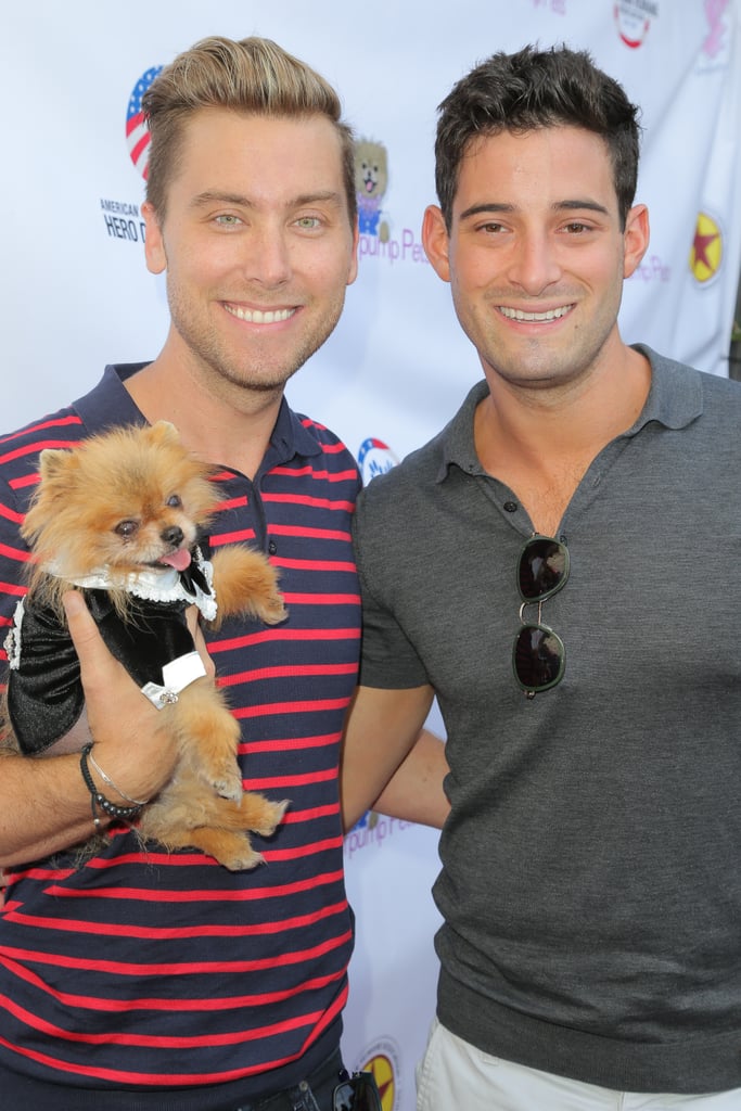Lance Bass and Michael Turchin held onto Lisa Vanderpump's dog, Giggy, during an August 2015 event in LA.