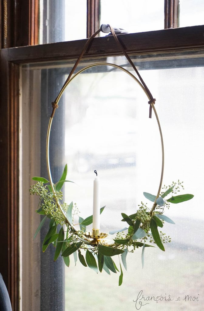 A DIY-candle wreath will brighten up the windows of your home.