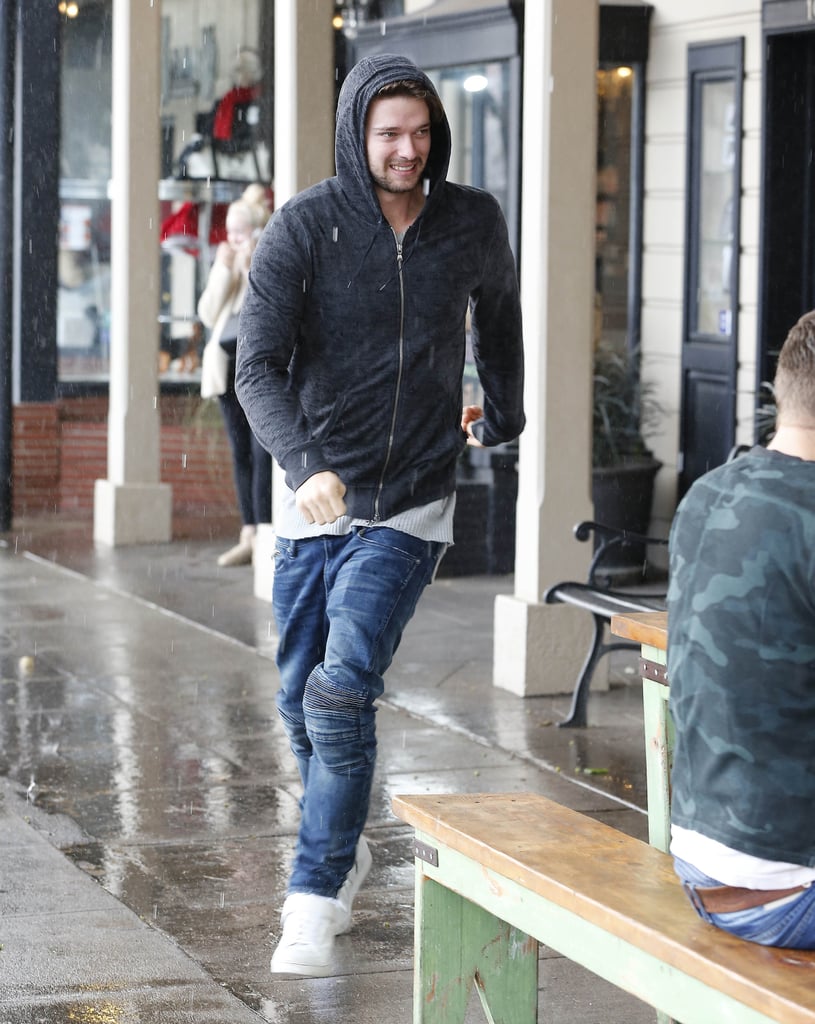 Patrick Schwarzenegger tried his best to avoid the rain at LA's Toluca Lake neighborhood on Sunday.