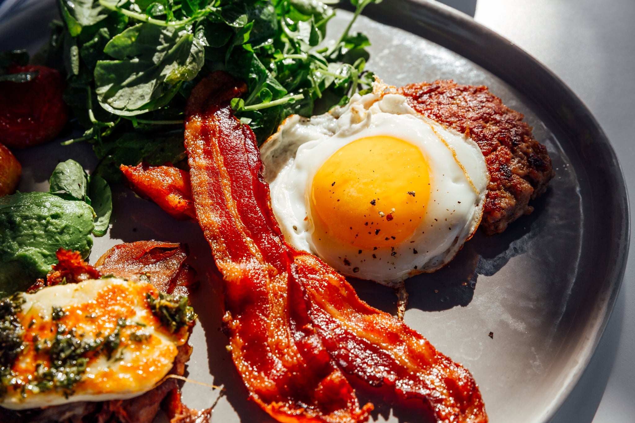 Plate of meat, eggs, and bacon.
